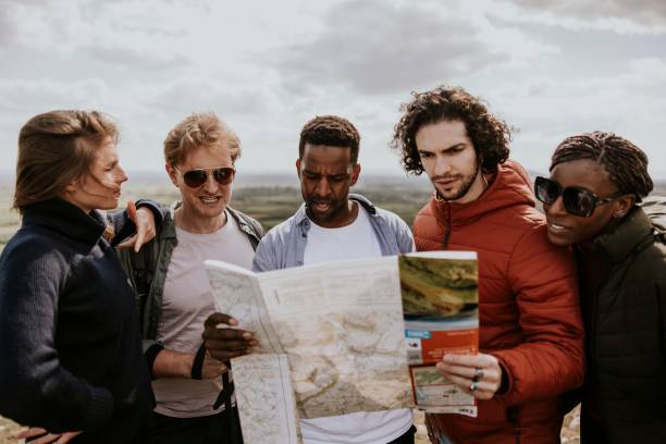 istock Group of friends looking at map photo 2158184981