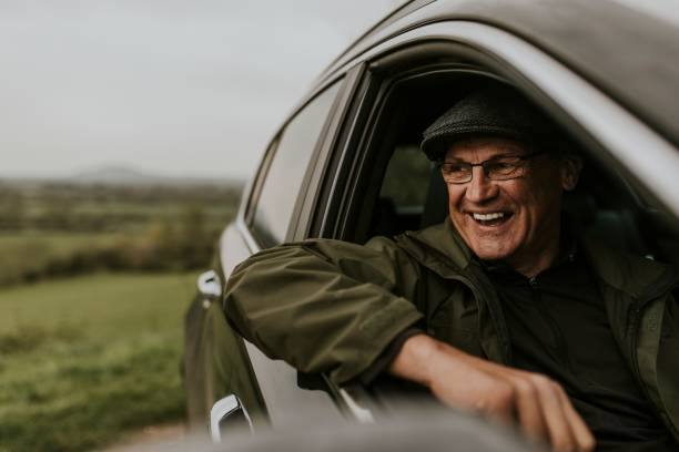 istock Senior man looking out car window 2158185160