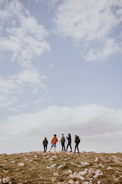istock Friends hiking together, outdoor activity 2158185243