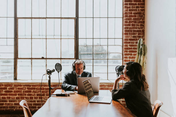 istock Female broadcaster interviewing her guest in a studio 2158186145