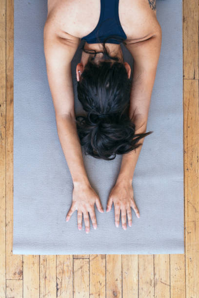 istock Active woman doing yoga in the room 2158186218