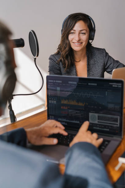 istock Female broadcaster interviewing her guest in a studio 2158186310