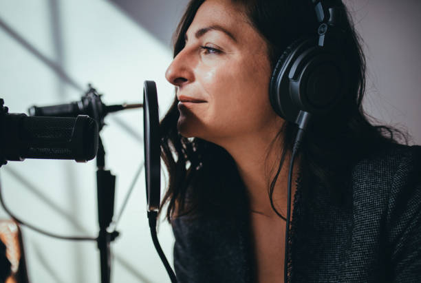istock Female radio host broadcasting live in a studio 2158186340