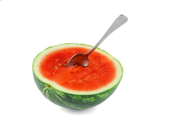 eaten watermelon and spoon isolated on white background