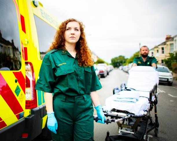 istock Paramedics rolling the ambulance stretcher 2158189392
