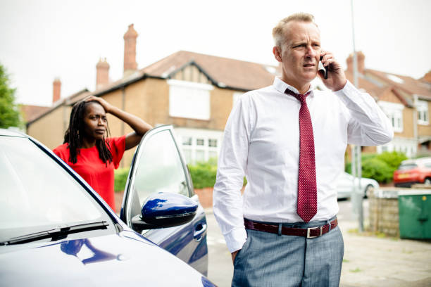 istock Man calling an insurance after a car accident 2158189542