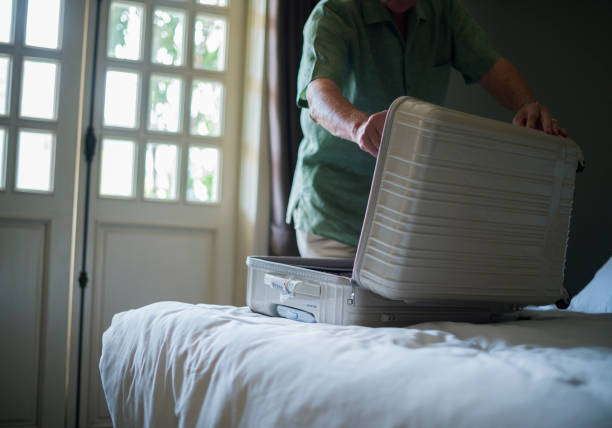 istock Senior Man Packing Luggage Trip Travel 2158189880