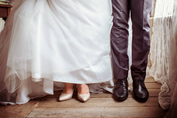 istock Couple take an abstract wedding shoot at legs 2158190951