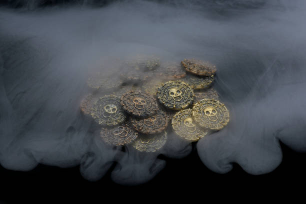 Antique doubloons coins with strange mist flowing over treasure handmade by photographer Thailand Asia