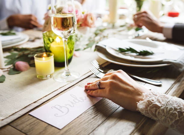 istock Bride showing Enagaement Ring on Left Hand on Wedding Celebration with Family 2158191129