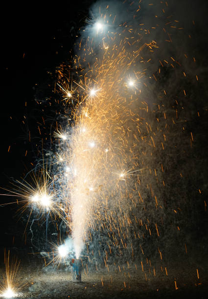istock colorful fountain fireworks stream into dark night 2158191816