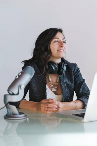istock Female radio host broadcasting live in a studio 2158192109
