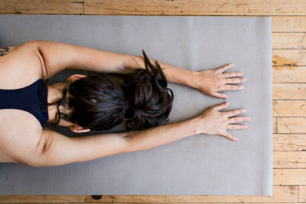 istock Active woman doing yoga in the room 2158192128