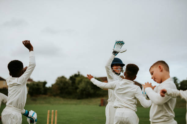 istock Young cricket players cheering for victory 2158192154