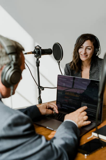 istock Female broadcaster interviewing her guest in a studio 2158192194