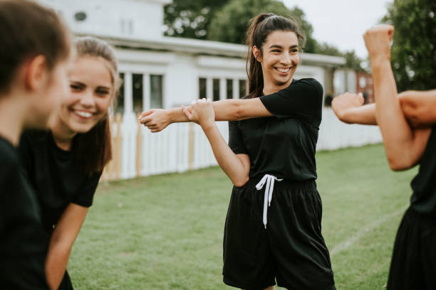istock Girls stretching on the field 2158192297