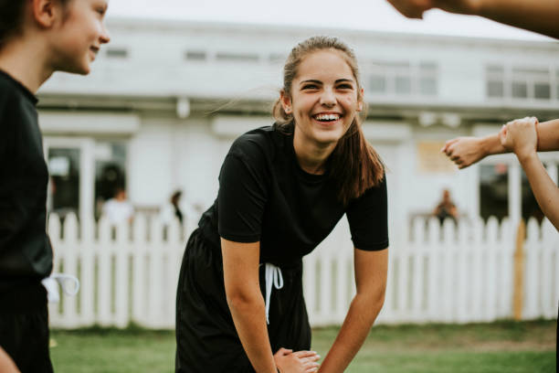 Girls stretching on the field