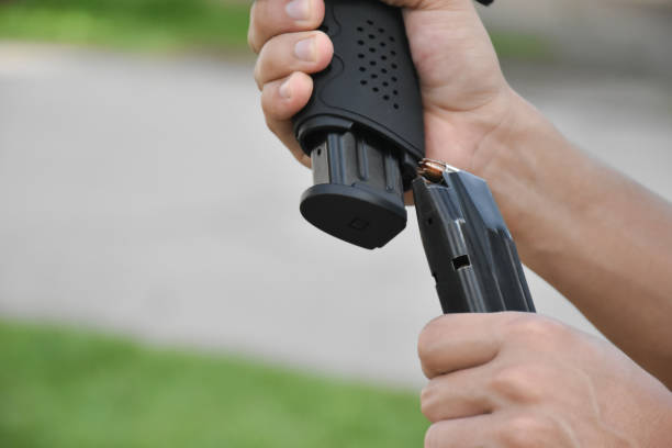 istock 9mm pistol gun and bullets 2158192309