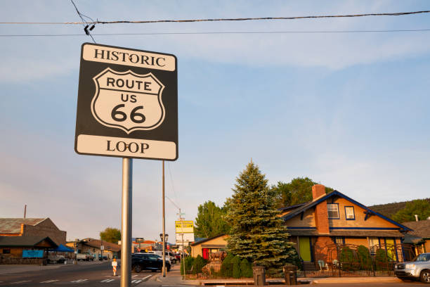 Williams, Coconino County, Arizona, USA,  July 7, 2024: Neon signs illuminate the summer night on the Route 66 on July 7, 2024 in Williams, Arizona, USA.