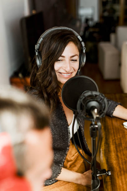 istock Female radio host broadcasting live in a studio 2158192407
