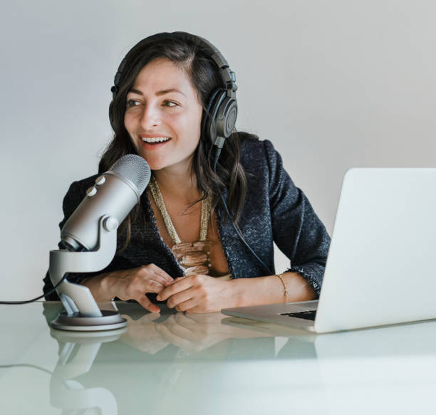 istock Female radio host broadcasting live in a studio 2158192439