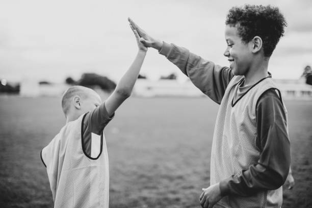 Junior football players doing a high five