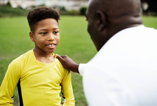 istock Football coach advising the goalkeeper 2158192523