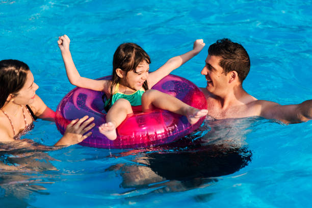 istock Mixed family enjoying summer pool time 2158193814