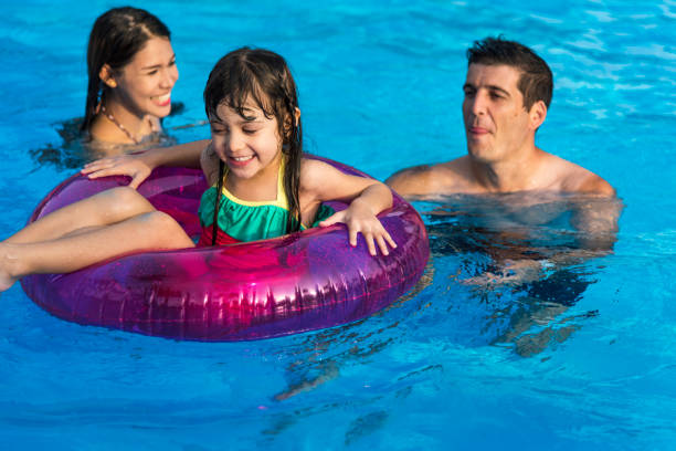 istock Family enjoying a nice day at the pool 2158194026