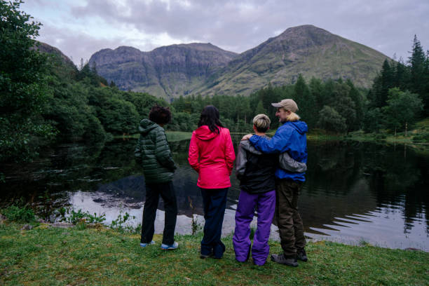 istock Friends relaxing by the riverside in the Highlands 2158194196