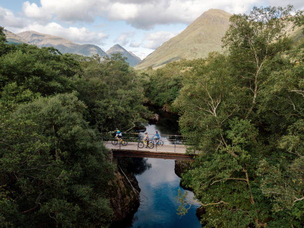 Group of cyclists crossing a bridge