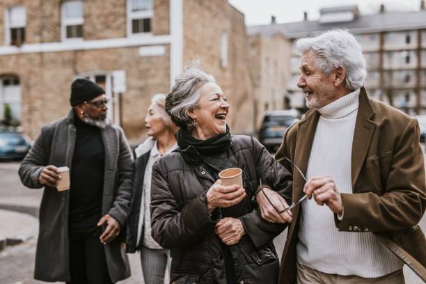 istock Happy friends walking together in the streets 2158194656