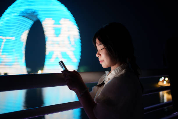 istock Female tourist looking at smartphone 2158194758