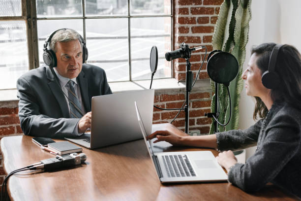 istock Female broadcaster interviewing her guest in a studio 2158195035