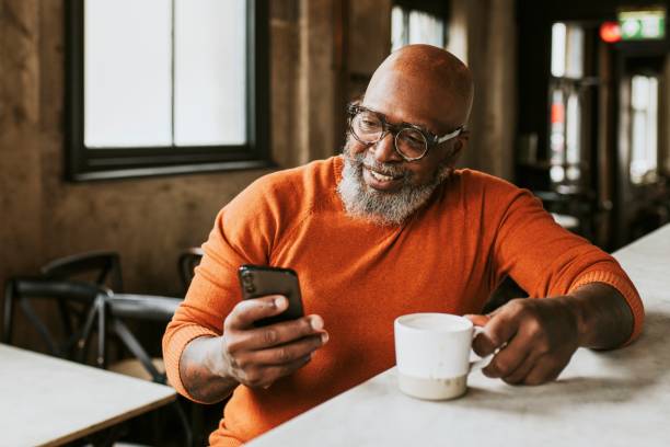 istock Bearded man checking social media oh his phone 2158195037