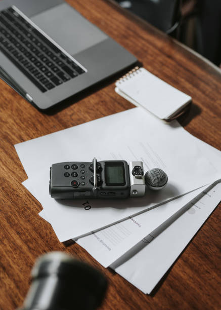 istock Portable sound recorder on a wooden table 2158195110