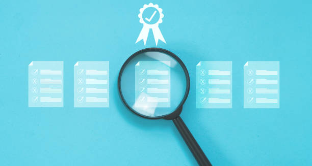 istock Magnify focus on quality warrantee on factory and certificate data. Electronic data and quality certificate. 2158196104