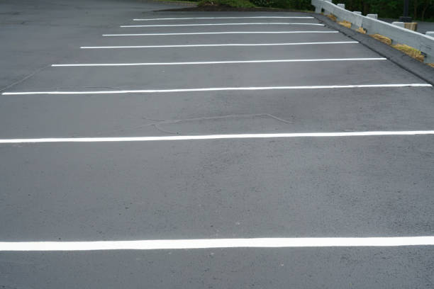 istock new paved empty parking lot with new painted strip lines 2158198293