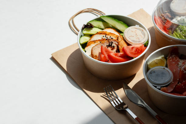 istock Take out poke bowl with craft bag on white background 2158202623
