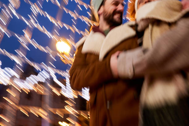 Two friends share a heartfelt embrace at night, surrounded by soft, warm lights. The scene reflects a joyful connection and deep friendship, creating a moment of lasting happiness.