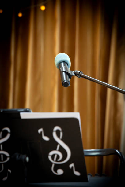 Microphone on a Stand in Colorfully Lit Event Stage Closeup