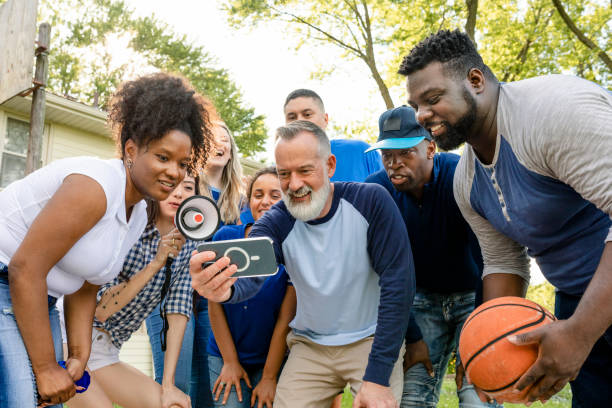 istock Basketball supporters watching their team win the game on a mobile phone 2158204300