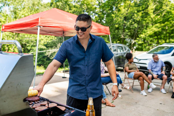 istock Manning the grill at a tailgate party 2158204354