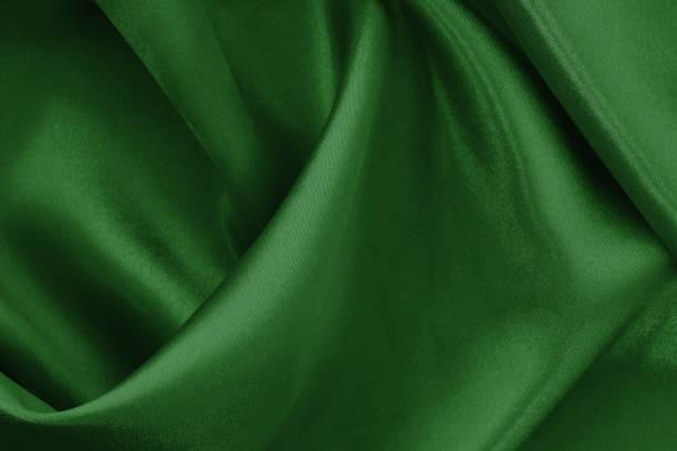 istock Dark green fabric cloth texture for background and design art work, beautiful crumpled pattern of silk or linen. 2158204450
