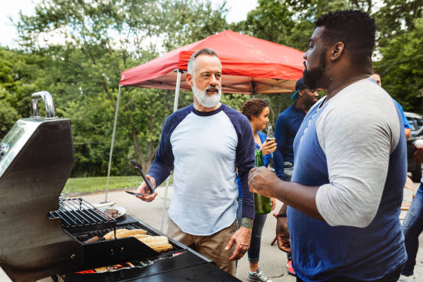 istock Manning the grill at a tailgate party 2158204463