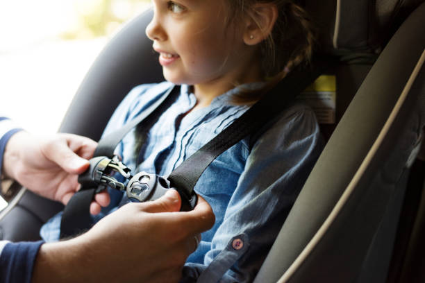 istock Father helping to put on the seat belt 2158204479