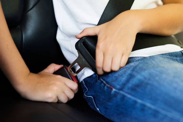 istock Boy fastening his seat belt 2158204480
