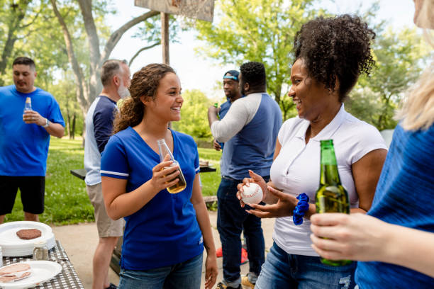 istock Friends drinking and eating at a tailgate party 2158204511