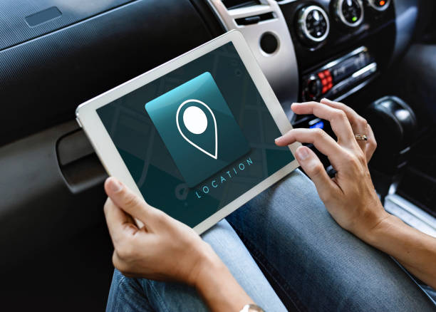 istock Woman using a digital tablet in the car 2158204587