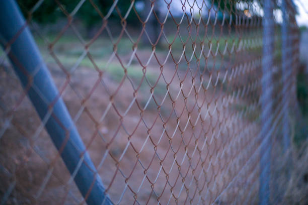 istock chain link fencing to farm land 2158206438